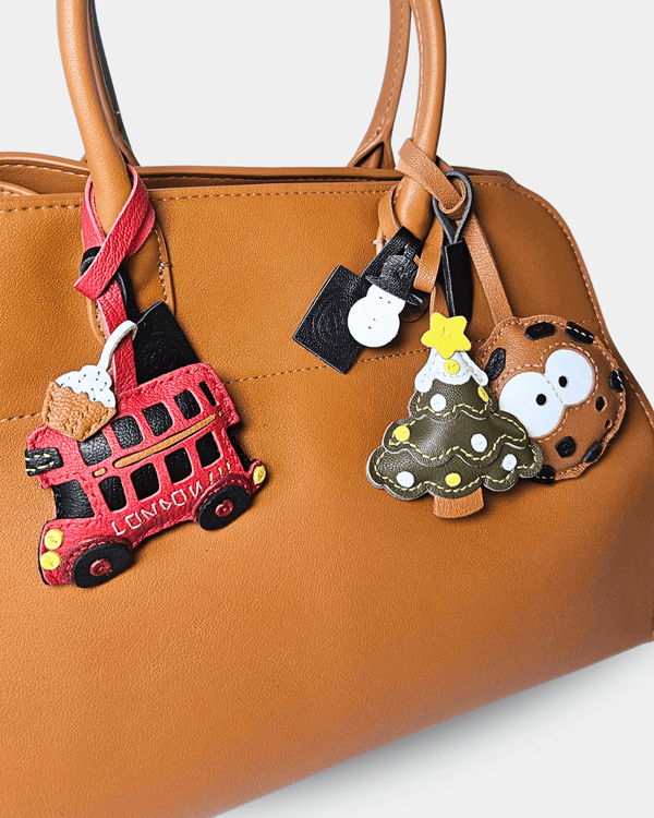 Brown handbag with decorative charms.