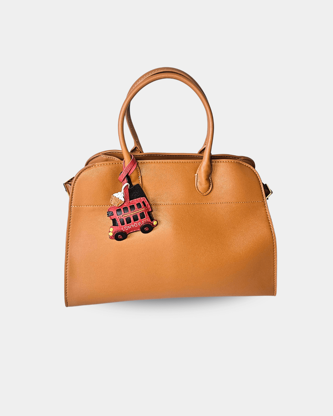 Brown handbag with a London bus charm.