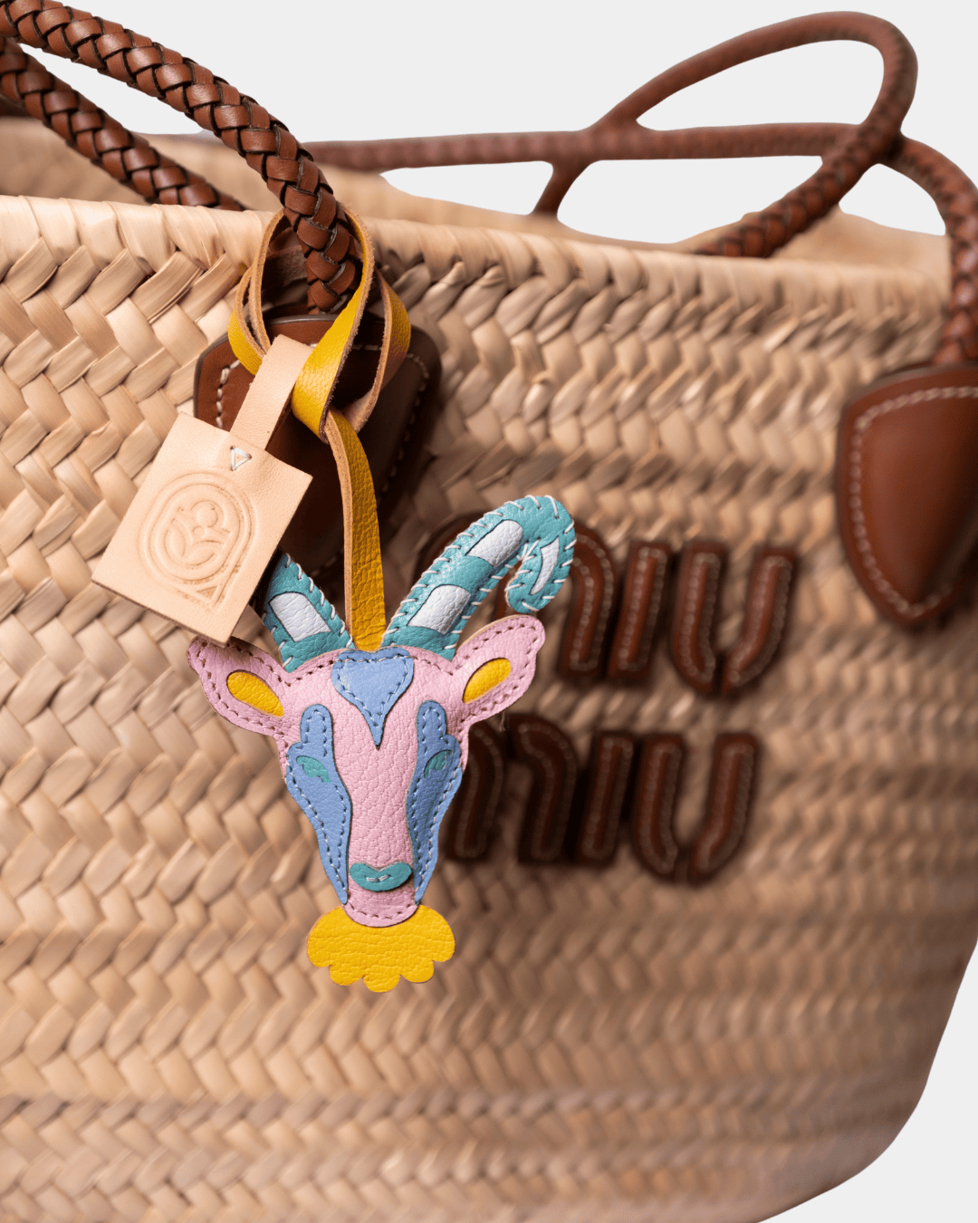 Miu Miu straw bag with goat charm