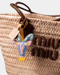 Miu Miu straw tote bag with goat charm