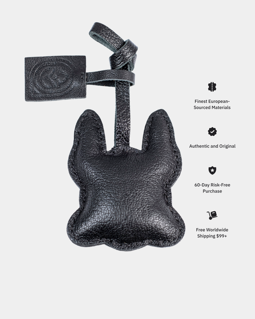 Black leather product with tag on a white background