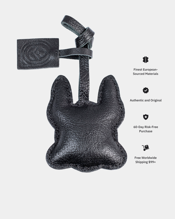 Black leather product with tag on a white background