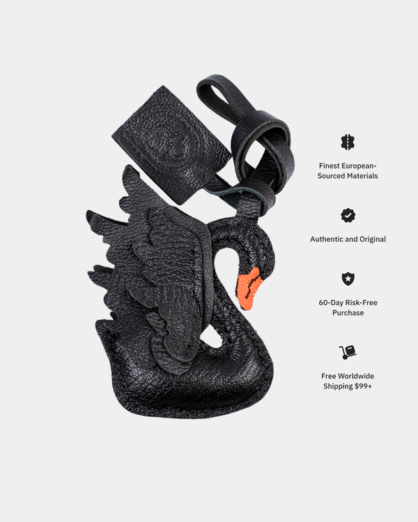 Black swan-shaped handbag with strap on a light gray background