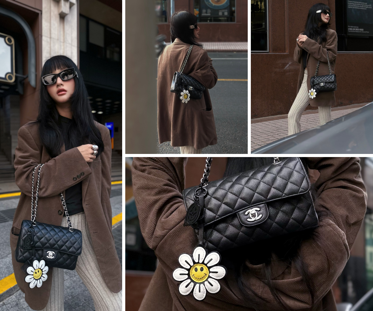Girl posing with a black quilted classic chanel bag with smiley face daisy leather bag charm
