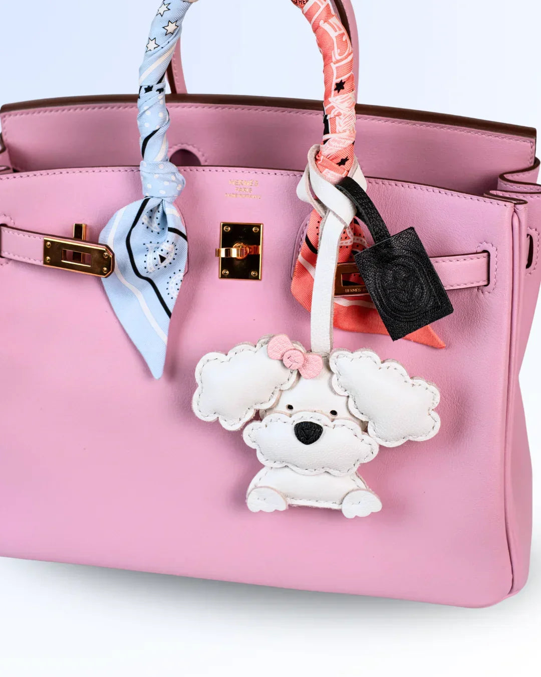 White poodle goatskin leather bag charm on luxury handbag