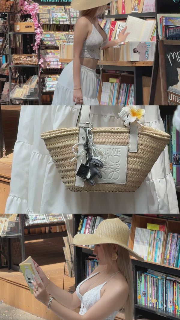 video of a stylish girl in summer outfit posing with loewe bag and grey horse premium leather bag charm