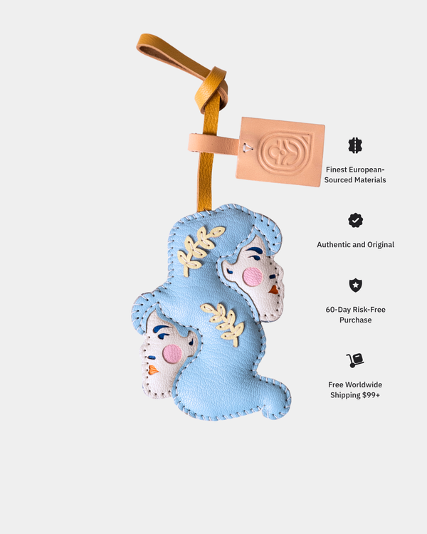 Blue decorative item with a face on a white background