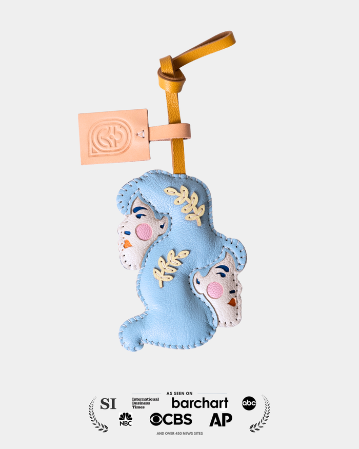 Blue tone doube faces leather bag charm representing the shape of Pisces horoscope